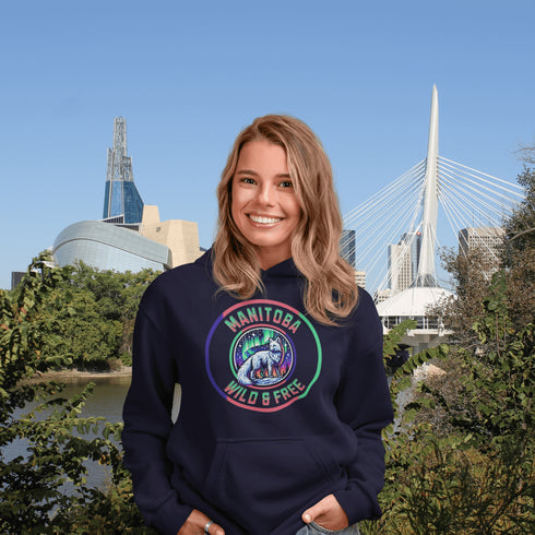 Unleash your wild side with our Manitoba – Wild & Free hoodie, featuring an enchanting graphic of an arctic fox beneath the dazzling northern lights.